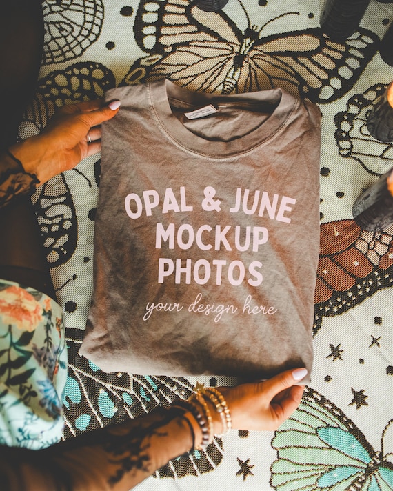 Espresso Shirt Mockup: Colorful Photo of Model Folding Espresso Comfort Colors® 1717 Tee Shot, Cozy Halloween Mockup with Boho Butterflies