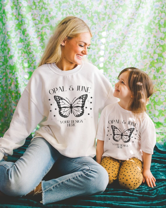 Cute Family Mockup for Matching Shirts: Photograph of Models Wearing White Gildan 18000 Sweatshirt and White Bella Canvas 3001Y Kids T-Shirt