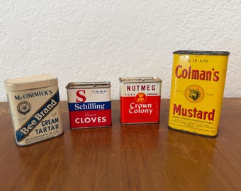 Vintage spice tins, McCormick's, Schilling, Crown Colony, and Colman's.