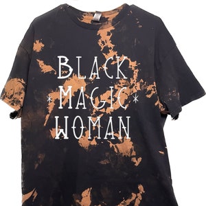 May include: Black tie-dye t-shirt with the text "BLACK MAGIC WOMAN" in white.