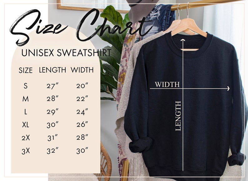 May include: Size chart for a unisex sweatshirt. The chart shows the length and width in inches for sizes S, M, L, XL, 2X, and 3X. A black sweatshirt is hanging on a wooden hanger.