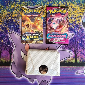 Pokemon bulk lot. 2 sealed booster packs plus 50 card lot. V or better guaranteed