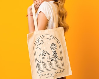 May include: A white canvas tote bag with black line art of a farmhouse, windmill, and sun. The text "Farmers Market Eat Fresh Eat Local" is printed on the bag.