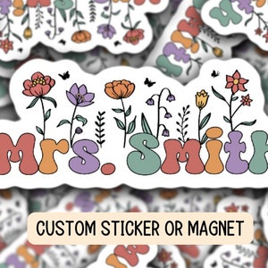 May include: A white sticker with a floral design and the text "Mrs. Smith" in colorful, retro-style lettering. The sticker is labeled "Custom Sticker or Magnet".