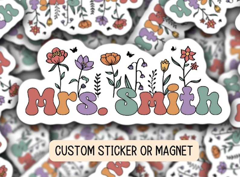 May include: A white sticker with a floral design and the text "Mrs. Smith" in colorful, retro-style lettering. The sticker is labeled "Custom Sticker or Magnet".