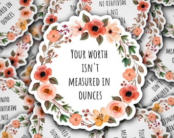 May include: A round sticker with a floral wreath design in shades of pink, orange, and green. The sticker features the text "Your worth isn't measured in ounces".