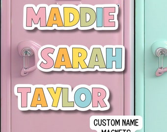 May include: Three colorful custom name magnets with the names Maddie, Sarah, and Taylor. The magnets are on a pink locker door with a silver handle. The text "CUSTOM NAME MAGNETS" is on a white rectangle below the names.