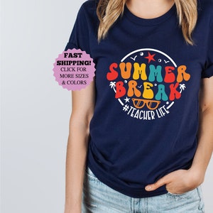 May include: Navy blue t-shirt with a colorful graphic that says "Summer Break #Teacher Life".