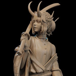 May include: A detailed bust sculpture of a person with stylized features, wearing a kimono-style garment and holding a sword. The sculpture has a light brown color and features intricate details, including horns and decorative elements in the hair.