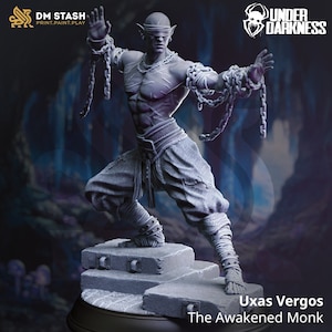 May include: A gray 3D printed miniature of a blindfolded elf monk with chains wrapped around his arms and legs. The monk is standing on a stone platform. The text "Uxas Vergos The Awakened Monk" is printed below the platform.