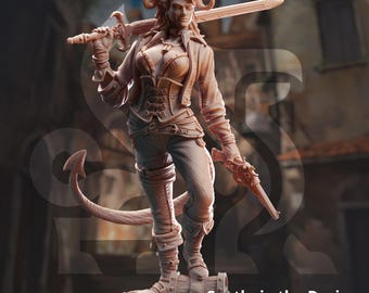 May include: A painted miniature figurine of a female tiefling character with horns, a tail, and a sword. She is wearing a leather jacket, a corset, and pants. The figurine is standing on a treasure chest. The text "Syntheia the Daring" and "Tiefling Scoundrel" is printed below the figurine.
