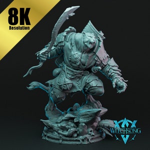 May include: A gray, detailed miniature figurine of a humanoid creature with a feline head, holding a sword and standing on a rocky base. The figurine is made by Witchsong.