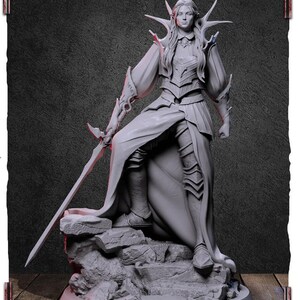 May include: A gray, detailed figurine of a female warrior with long hair, wearing a flowing robe and armor, holding a sword. She stands on a rocky base.
