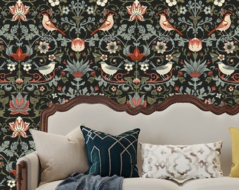 May include: A white sofa with decorative pillows and a dark blue throw blanket. The background features a wallpaper with a floral and bird pattern in shades of red, green, and cream on a black background.