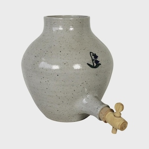May include: A speckled gray ceramic water dispenser with a wooden spigot. The dispenser has a bulbous body and a narrow neck. A blue floral design is painted on the side.