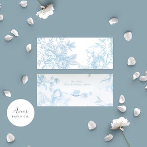 May include: Two white and blue floral design cards with the text "Best Wishes" and "Aveer Paper Co." on a blue background with white flower petals. The cards have a delicate, vintage aesthetic.