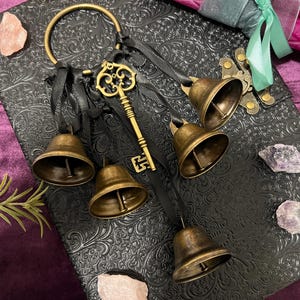 May include: A set of three ceramic mugs with a speckled, matte finish. The mugs are in shades of cream, light gray, and dark gray. Each mug has a simple, minimalist design, perfect for coffee or tea.