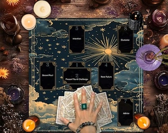 May include: A dark blue tarot reading cloth featuring gold celestial patterns, sun rays, and numbered card placement boxes labeled Intention, Outcome, Recent Past, Present You & Challenge, Near Future, and Advice, surrounded by lit candles.