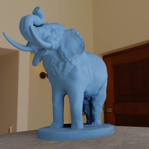 May include: A blue ceramic sculpture of an elephant with its trunk raised in the air. The elephant is standing on a base.