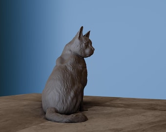 May include: A grey ceramic cat figurine sitting on a wooden surface. The cat is looking to the right and has a fluffy tail.