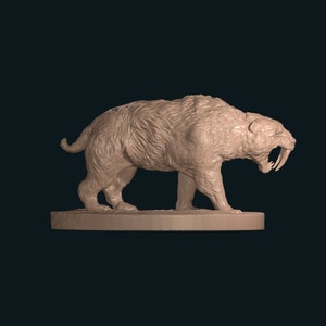 May include: A detailed, beige-colored sculpture of a saber-toothed cat with large fangs. The sculpture is standing on a circular base.
