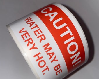 ¡CAUTELA! El agua puede ser etiquetas muy calientes.