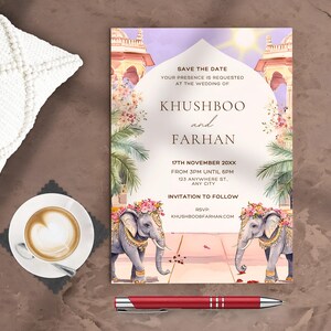 May include: Save the date wedding invitation with a pink, purple, and white colour scheme. The invitation features an illustration of an ornate archway with two elephants decorated with flowers. The text reads "Save the Date, Your presence is requested at the wedding of Khushboo and Farhan, 17th November 20XX, From 3PM until 6PM, 123 Anywhere St., Any City, Invitation to Follow, RSVP, KhushbooFarhan.com".
