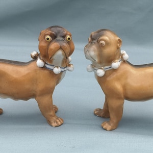 A Good Pair 0f  19th Century Continental Porcelain Models of Standing Pug Dogs c 1880