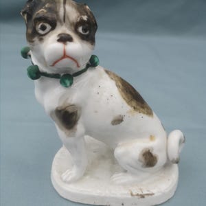 Continental Porcelain Model of Seated Pug Dog on Plinth c 1900
