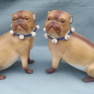 A Good Pair 0f  19th Century Continental Porcelain Models of Seated Pug Dogs c 1880 Large size