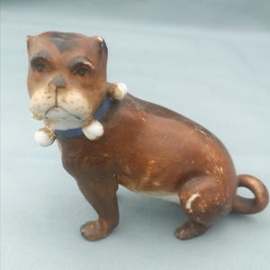 A 19th Century Continental Porcelain Model of Small Seated Pug Dog c 1880
