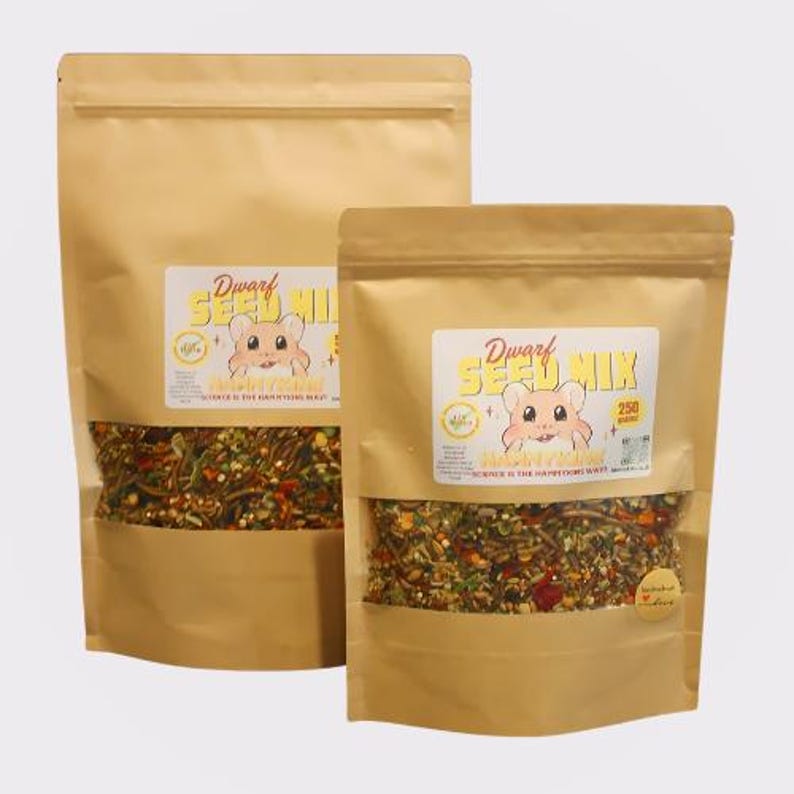 May include: Two brown paper bags filled with a mix of seeds and other ingredients for dwarf hamsters. The bags have labels that say "Dwarf Seed Mix" and feature a cartoon hamster. The smaller bag is labeled "250 grams".