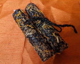 TWO 4" rolled beeswax protection candles dressed with calendula, wormwood, and mugwort