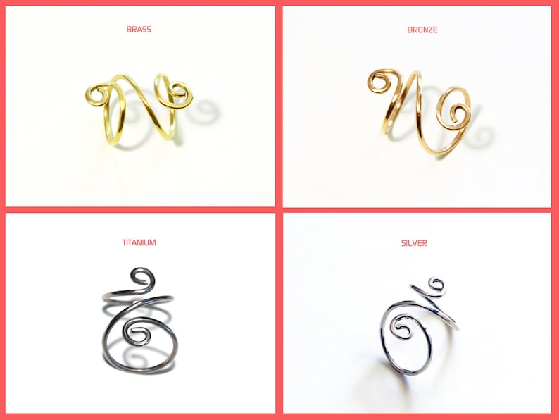 May include: Four wire rings in different metal finishes: brass, bronze, titanium, and silver. Each ring is a simple, double-loop design.