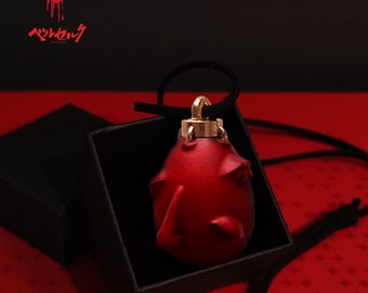 Collier Behelit rouge à collectionner Berserk : un symbole du pouvoir obscur !