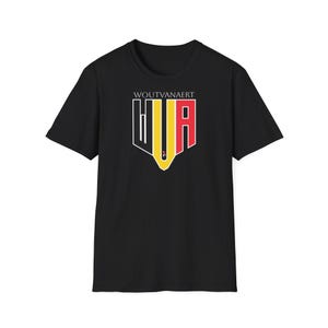 May include: Black t-shirt with the name "WOUTVANAERT" above a graphic in black, yellow, and red. The graphic is a shield-like emblem with the letters "WVA" integrated. The shirt is made of a soft material and is suitable for casual wear.