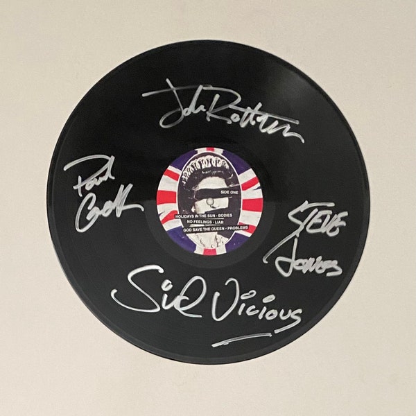 Exhibición de discos de vinilo firmados por Sex Pistols