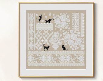 May include: Cross-stitch artwork featuring a beige background with white floral and lace patterns. Black cat silhouettes are playfully positioned throughout the design. The artwork is framed in a gold-colored frame.