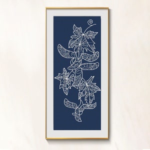 May include: A framed print featuring a white line drawing of maple leaves and seed pods against a dark blue background. The leaves and pods have intricate patterns. The frame is gold-colored, and the artwork is displayed vertically.
