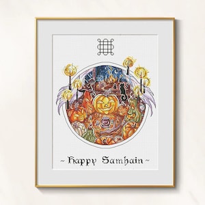 May include: Framed cross-stitch art depicting a Halloween scene with carved pumpkins, candles, and a black cat. The circular design includes the text "happy Samhain" at the bottom, perfect for seasonal decor.