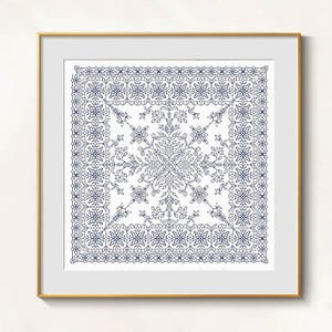 May include: Square framed artwork featuring a detailed blue and white floral design. The intricate pattern includes a central motif and a decorative border. The artwork is displayed in a gold frame.