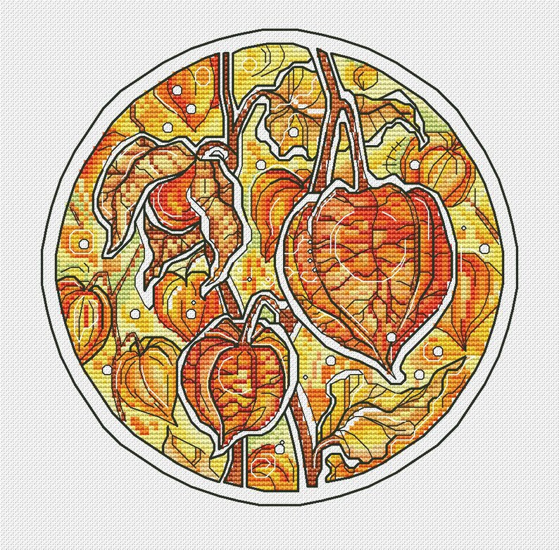 May include: A round cross-stitch design featuring orange and yellow Chinese lantern plants. The design includes detailed leaves and lantern-shaped fruits, all outlined in black against a yellow and green background. The artwork is set within a white border.