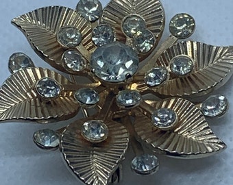 CORO goldtone and white rhinestone flower brooch