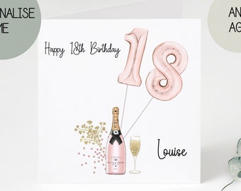 May include: A pink and gold birthday card with the text "Happy 18th Birthday" and the number 18 in pink balloons. There is a bottle of champagne and a champagne flute with gold confetti and a floral design. The name "Louise" is written at the bottom of the card.