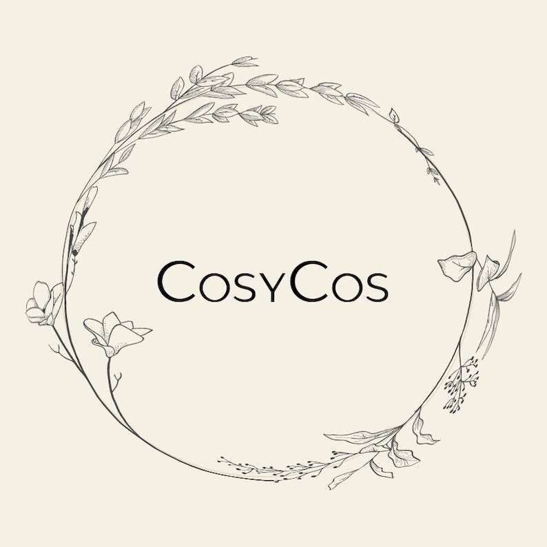 May include: A black and white illustration of a floral wreath with the text "CosyCos" in the center.