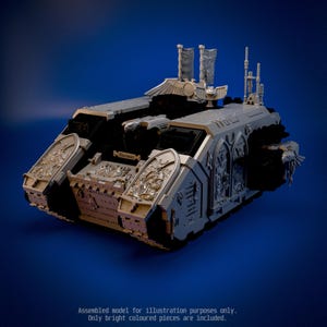 May include: A light grey plastic model tank featuring intricate relief carvings of figures and gothic arches on the side panels. The top includes two vertical banners and an eagle emblem. Text on the front reads: Assembled model for illustration purposes only. Only bright coloured pieces are included.
