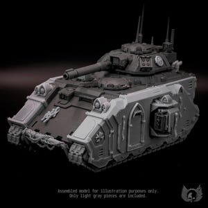 May include: A gray plastic model tank featuring a rotating turret with a long cannon, multiple antennas, and side-mounted weapon systems. The front hull displays a chain detail and a cross emblem. Text at the bottom reads: Assembled model for illustration purposes only. Only light gray pieces are included.