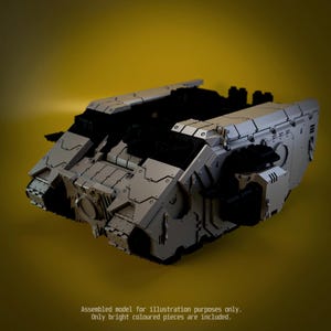 May include: A grey and black plastic model tank featuring angular armour plating, recessed panel lines, and visible tread sections. The text at the bottom reads: Assembled model for illustration purposes only. Only bright coloured pieces are included.