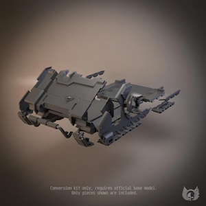 May include: A grey plastic conversion kit for a miniature vehicle, featuring angular armor plating, mechanical track segments, and a small skull emblem on the front panel. The kit includes multiple unpainted components for assembly.
