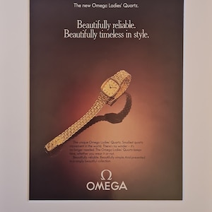 May include: An advertisement for an Omega Ladies' Quartz watch. The watch has a gold band and a rectangular gold face. The text reads, "Beautifully reliable. Beautifully timeless in style." The Omega logo is at the bottom.